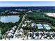 Scenic aerial view of the community, highlighting a lake, walking trails, and amenities at 134 Edinburgh Dr, Canton, GA 30115