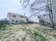 Backyard featuring a patio, fire pit, and a fenced yard at 134 Edinburgh Dr, Canton, GA 30115