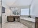 Bathroom boasts a glass enclosed shower, and a soaking tub with a tiled backsplash at 134 Edinburgh Dr, Canton, GA 30115