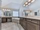 Bathroom showcases dual vanity sinks, a soaking tub, and a glass enclosed shower at 134 Edinburgh Dr, Canton, GA 30115