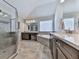 Lovely bathroom features neutral tile, lots of counter space, and a glass-enclosed shower at 134 Edinburgh Dr, Canton, GA 30115