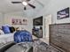 Bedroom featuring wall art, flat-screen TV, dresser, and ceiling fan at 134 Edinburgh Dr, Canton, GA 30115