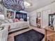 Cozy bedroom featuring a white bed, area rug, and accent decorations at 134 Edinburgh Dr, Canton, GA 30115