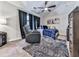 Bedroom features a recliner, accent wall art, and blue color scheme at 134 Edinburgh Dr, Canton, GA 30115