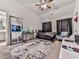 Bedroom features a full-length mirror, gaming setup, and plush area rug at 134 Edinburgh Dr, Canton, GA 30115