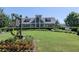 A perfectly manicured lawn surrounds the Harmony Lake Club clubhouse at 134 Edinburgh Dr, Canton, GA 30115