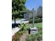 The Harmony Lake Club sign is perfectly framed by flowers and landscaping at 134 Edinburgh Dr, Canton, GA 30115