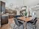 Charming dining area with table and chairs adjacent to a modern kitchen and ample natural light at 134 Edinburgh Dr, Canton, GA 30115