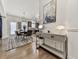 Open dining area with a modern table and chairs, decorative lighting, and access to the kitchen at 134 Edinburgh Dr, Canton, GA 30115