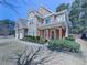 Beautiful two-story home with stone and brick accents, a covered porch, and a well-maintained front yard at 134 Edinburgh Dr, Canton, GA 30115