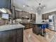 Modern kitchen with stainless steel appliances, granite countertops, and a stylish center island with seating at 134 Edinburgh Dr, Canton, GA 30115