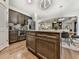 Contemporary kitchen with island, stainless steel appliances, and seamless flow to the dining and living areas at 134 Edinburgh Dr, Canton, GA 30115