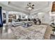 Expansive open-concept living room with hardwood floors, a stone fireplace, and a view to the kitchen at 134 Edinburgh Dr, Canton, GA 30115