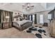 Comfortable main bedroom features neutral carpet, ceiling fan, and decorative touches at 134 Edinburgh Dr, Canton, GA 30115