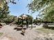 A playground with multiple slides and climbing areas at Harmony Lake at 134 Edinburgh Dr, Canton, GA 30115