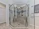 Modern shower features stylish tile work, dual shower heads, and glass enclosure at 134 Edinburgh Dr, Canton, GA 30115