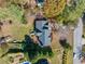 Aerial view of home featuring a new roof, a wooden deck, and a spacious backyard with mature trees at 210 Timber Laurel Ct, Lawrenceville, GA 30043