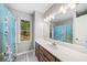 Bathroom featuring natural light, vanity with sink, and shower-tub combination at 210 Timber Laurel Ct, Lawrenceville, GA 30043
