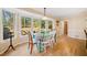 Cozy breakfast nook featuring a turquoise dining set near bright windows with a backyard view at 210 Timber Laurel Ct, Lawrenceville, GA 30043