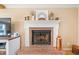 Close up view of a fireplace with brick base and mantel at 210 Timber Laurel Ct, Lawrenceville, GA 30043
