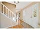 Bright foyer with hardwood floors and a staircase leading to the upper level at 210 Timber Laurel Ct, Lawrenceville, GA 30043