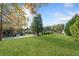 A large, well-manicured front lawn with mature trees and shrubbery in a residential neighborhood at 210 Timber Laurel Ct, Lawrenceville, GA 30043