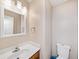 Neutral powder room featuring a white vanity and a single-lever faucet at 210 Timber Laurel Ct, Lawrenceville, GA 30043