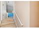 Carpeted staircase leading to the upper level, showcasing the home's interior design and layout at 210 Timber Laurel Ct, Lawrenceville, GA 30043