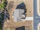 Aerial shot of a home featuring a well-maintained roof and a surrounding yard near a road at 3505 Aqua Point Pl, Cumming, GA 30041
