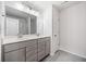 Bathroom featuring double vanity, granite counters, modern fixtures and tile flooring at 3505 Aqua Point Pl, Cumming, GA 30041