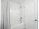 Bathroom featuring shower and tub combo with gray tile surround at 3505 Aqua Point Pl, Cumming, GA 30041