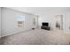 A spacious bonus room with two windows, providing natural light and an open, carpeted floor at 3505 Aqua Point Pl, Cumming, GA 30041