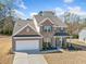 Charming two-story brick home with a well-manicured lawn, a two-car garage, and inviting curb appeal at 3505 Aqua Point Pl, Cumming, GA 30041