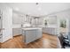 Modern kitchen with stainless steel appliances, gray cabinets, and a central island at 3505 Aqua Point Pl, Cumming, GA 30041