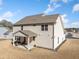 Back of house with covered patio area, neutral siding, and view of adjacent homes in the neighborhood at 3505 Aqua Point Pl, Cumming, GA 30041
