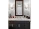 Modern bathroom with dark wood vanity, marble countertop, and stylish lighting at 3630 Peachtree Ne Rd # 2009, Atlanta, GA 30326