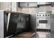 Gourmet kitchen features stainless steel appliances, granite countertops, and custom dark wood cabinetry at 3630 Peachtree Ne Rd # 2009, Atlanta, GA 30326