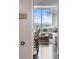 Sun-filled living room with stylish chandelier and great views of the city skyline at 3630 Peachtree Ne Rd # 2009, Atlanta, GA 30326