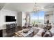 Cozy living room with entertainment center, guitars, comfortable seating, and an abundance of natural light at 3630 Peachtree Ne Rd # 2009, Atlanta, GA 30326