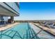 Rooftop pool with comfortable lounge chairs and panoramic city views, perfect for relaxation at 3630 Peachtree Ne Rd # 2009, Atlanta, GA 30326
