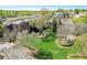 Aerial view of a condo complex with landscaping and green grass and trees at 5910 Bond St # 401, Cumming, GA 30040