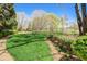 A beautifully manicured front yard featuring vibrant green grass and lush landscaping at 5910 Bond St # 401, Cumming, GA 30040