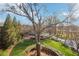 Expansive green lawn with walking paths and mature trees under a bright blue sky at 5910 Bond St # 401, Cumming, GA 30040