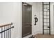 Hallway door 401 with a black metal ladder and a railing at 5910 Bond St # 401, Cumming, GA 30040
