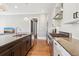 Well-appointed kitchen with granite counters, stainless steel appliances, and a center island with a sink at 5910 Bond St # 401, Cumming, GA 30040
