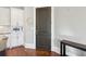 Clean kitchen showcases white cabinetry and stainless steel appliances, complemented by a stylish dark interior door at 5910 Bond St # 401, Cumming, GA 30040