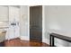 This kitchen features white cabinets, stainless steel appliances, and an exterior door to the dining area at 5910 Bond St # 401, Cumming, GA 30040