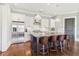 Modern kitchen featuring a large island with seating, stainless appliances, and hardwood floors at 5910 Bond St # 401, Cumming, GA 30040
