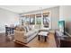 Bright living room featuring natural light and a view of the outdoor greenery at 5910 Bond St # 401, Cumming, GA 30040