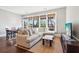 Comfortable living room featuring hardwood floors, neutral walls, and a view to a porch at 5910 Bond St # 401, Cumming, GA 30040